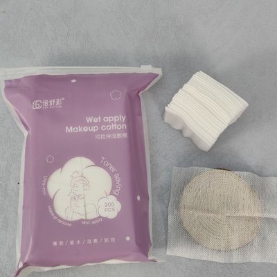 品質 伸縮性のある濡れた圧縮コットンメイク保湿フェイスコットンパッド 工場